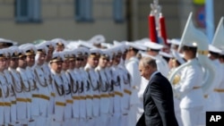 Russian President Vladimir Putin arrives to attend the military parade during the Navy Day celebration in St.Petersburg, Russia, Sunday, July 26, 2020.(AP Photo/Dmitri Lovetsky, Pool)