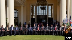 Representatives of the Southern African Development Community (SADC) pose for a family photo during the 35th SADC ordinary summit of head of state and government in Gaborone, Aug. 17, 2015. 