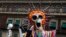 Performers in costume attend a Day of the Dead parade in Mexico City, Sunday, Oct. 27, 2019.