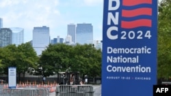 Safety barriers are delivered on a fork lift as preparations continue outside the United Center ahead of the Democratic National Convention (DNC) in Chicago, Illinois on August 17, 2024.