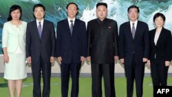 North Korean leader Kim Jong-Un (3rd R) photographed with the delegation of the International Liaison Department of Chinese Communist Party led by Wang Jiarui (3rd L) in Pyongyang, August 3, 2012.