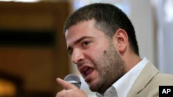 Osama Morsi, son of ousted Egyptian President Mohamed Morsi, speaks during a press conference in Cairo, July 22, 2013. 