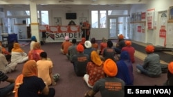 Amrita Bamrah, Policy Director of SALDEF, addresses attendees of the "SALDEF Wears Orange" Event. 