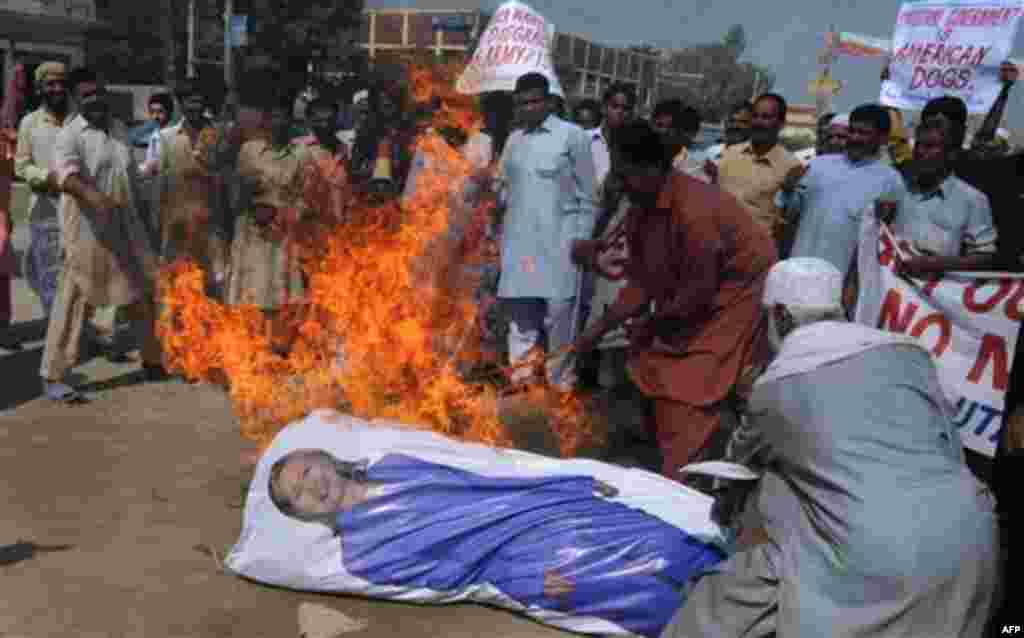 Members of United Citizens Organization burn an effigy of U.S. Secretary of State Hillary Rodham Clinton during a rally against her visit to Pakistan, Friday, Oct. 21, 2011. Clinton led an unusually large U.S. delegation for two days of talks with civilia