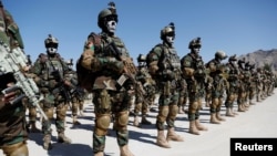 FILE - Afghan Special Forces attend their graduation ceremony in Kabul, Afghanistan June 17, 2020. 