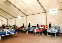 FILE - COVID-19 patients being treated at Queen Elizabeth Central Hospital in Blantyre, Malawi, Jan. 30, 2021.