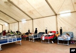 FILE - COVID-19 patients being treated at Queen Elizabeth Central Hospital in Blantyre, Malawi, Jan. 30, 2021.