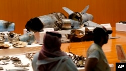 FILE - The Saudi military displays what they say are an Iranian cruise missile and drones used in recent attacks on its oil industry, during a press conference in Riyadh, Saudi Arabia, Sept. 18, 2019. 