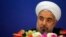 FILE - Iran's President Hassan Rouhani arrives at a news conference after the fourth Conference on Interaction and Confidence Building Measures at the Asia summit, in Shanghai, May 22, 2014.