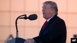 President Donald Trump speaks during a rally for Sen. Cindy Hyde-Smith, R-Miss., at Tupelo Regional Airport, Nov. 26, 2018, in Tupelo, Mississippi. 