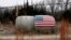 A U.S. flag is attached to a hay bale on a farm in Crete, Nebraska, Jan. 4, 2017. 