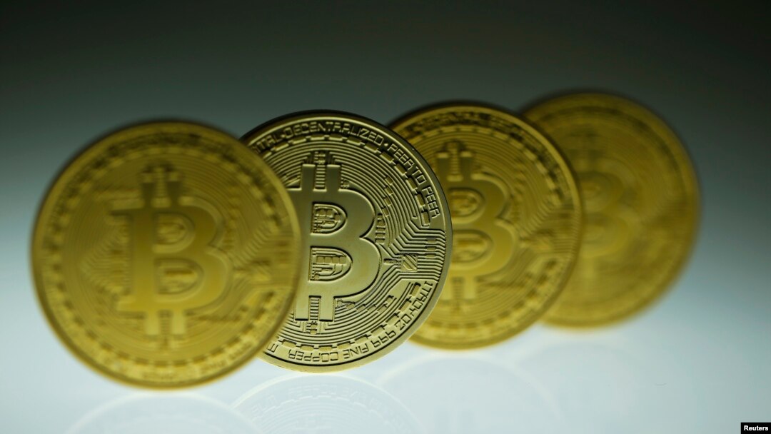 Mock Bitcoins are displayed on a table in an illustration picture taken in Berlin, Jan. 7, 2014.