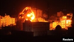 Flame and smoke are seen during an Israeli airstrike in Gaza City, March 25, 2019. 