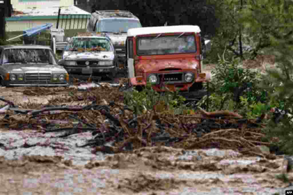 Cars stuck in a flooded area of Silverado Canyon, Calif., Wednesday, Dec. 22, 2010. Storm runoff and mud has prompted the evacuation of about 30 people in the area. After days of relentless rain, Southern California on Wednesday was facing the most intens