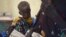 FILE - Nyagoah Taka Gatluak, a severely malnourished one-year-old child, sits on her mother's lap in the Doctors Without Borders clinic in Leer town, South Sudan.