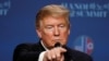 FILE PHOTO: U.S. President Donald Trump attends a news conference in Hanoi