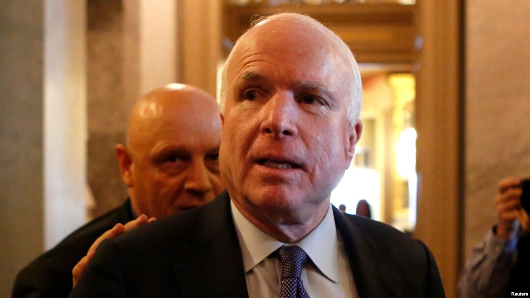 FILE - U.S. Senator John McCain (R-AZ) leaves after Senator Dianne Feinstein's (D-CA) speech on the Senate floor on Capitol Hill, in Washington, Dec. 9, 2014.