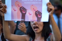 FILE - Activists protest in Barcelona, Spain, June 21, 2018. A Spanish court triggered a new wave of outrage Oct. 31, 2019, by acquitting five men of gang rape and instead finding them guilty of a lesser charge of sexual abuse.