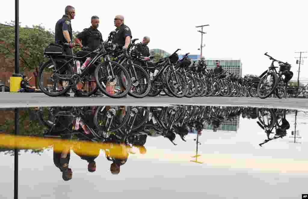 Cleveland bicycle police officers wait for their next assignments as preparations continues for the Republican National Convention in Cleveland, July 16, 2016.