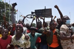 People celebrate as the Guinean Special Forces arrive at the Palace of the People in Conakry, September 6, 2021.