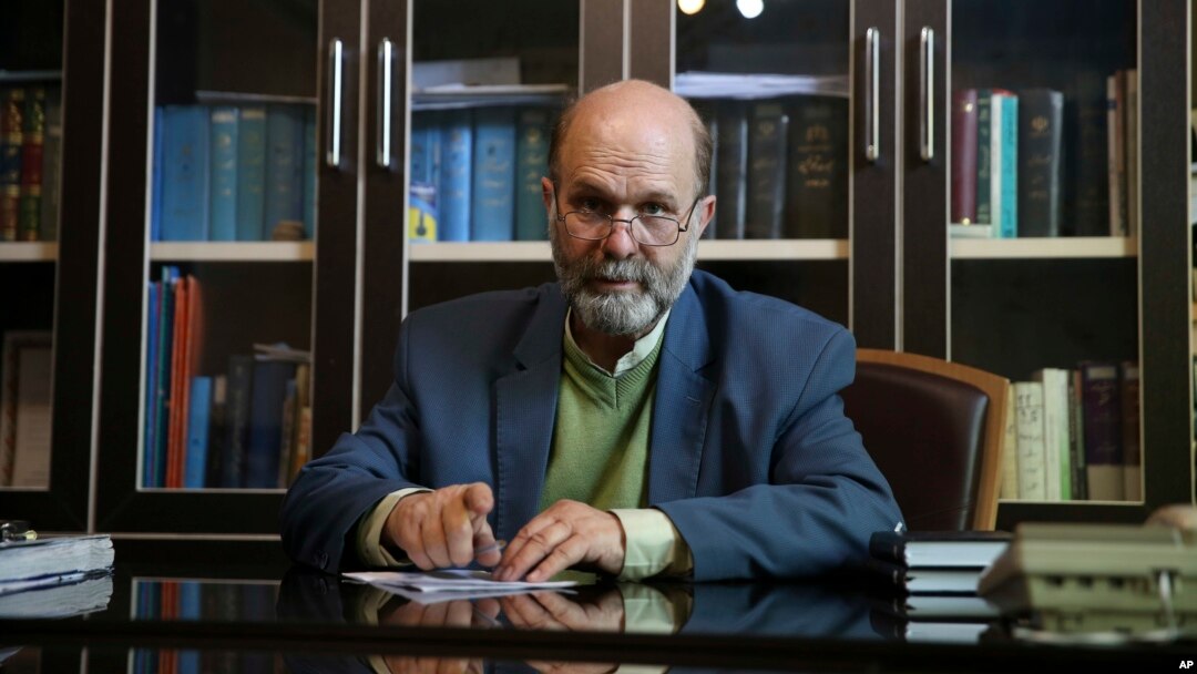 FILE - In this Feb. 25, 2016, file photo, Iranian lawyer Mahmoud Alizadeh Tabatabei, who represents detained dual U.S.-Iranian citizens Siamak Namazi and his father Baquer works at his office in Tehran, Iran. 