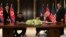 U.S. President Donald Trump and North Korea's leader Kim Jong Un sign documents that acknowledge the progress of the talks and pledge to keep momentum going, after their summit at the Capella Hotel on Sentosa island in Singapore, June 12, 2018. 