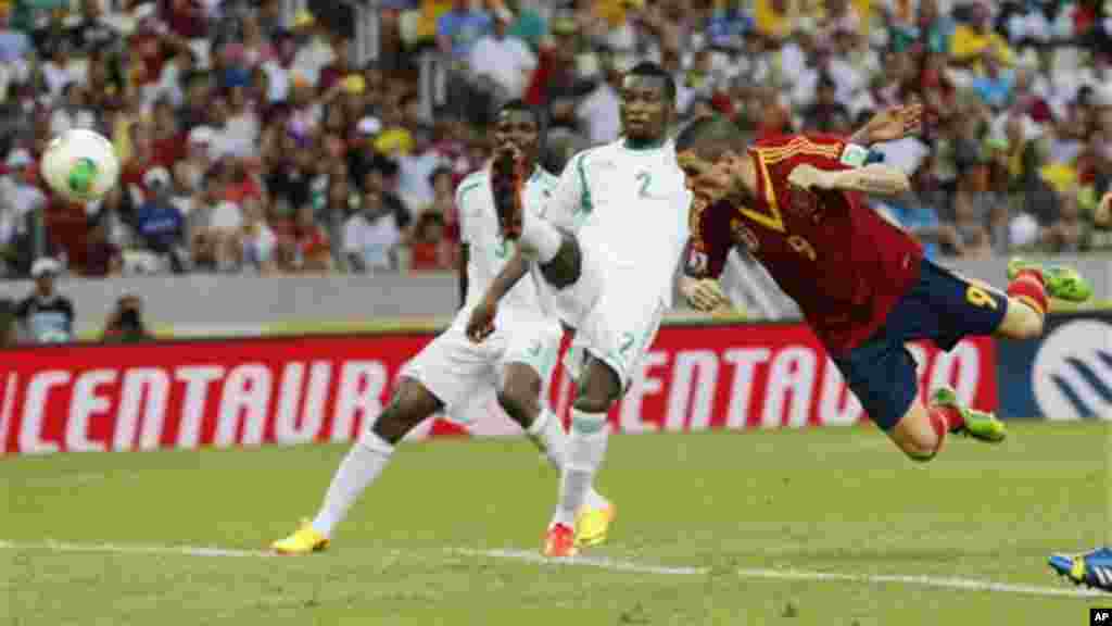 Spain's Fernando Torres, right, scores his side's 2nd goal.