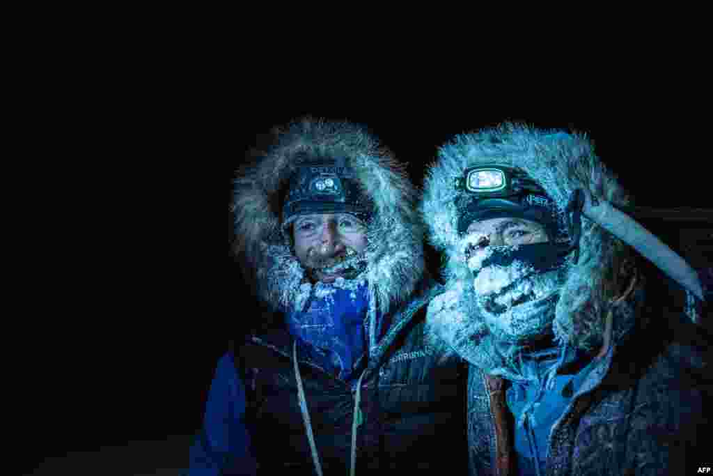 Borge Ousland (L) of Norway and South African-born Swiss Mike Horn pose as they arrive at the Lance icebreaker boat in Norwegian waters of the Arctic Ocean, after succesfully crossing the Arctic Ocean on skis. (Handout picture by the Mike Horn Sarl)