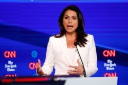Rep. Tulsi Gabbard, D-Hawaii, participates in a Democratic presidential candidates debate at Otterbein University, Oct. 15, 2019, in Westerville, Ohio.