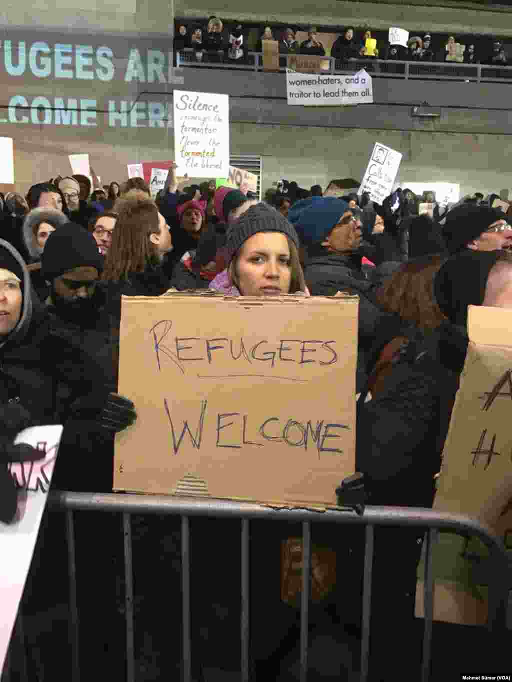 Hundreds of demonstrators gathered at JFK airport to protest President Trump's immigration order 