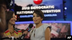 Actress Eva Longoria, right, is interviewed by Mariana Atencio of Univision on the floor of the Democratic National Convention in Charlotte, N.C., Sept. 6, 2012. 