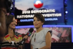 FILE - Actress Eva Longoria, right, is interviewed by Mariana Atencio of Univision on the floor of the Democratic National Convention in Charlotte, N.C., Sept. 6, 2012.