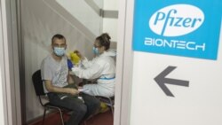 A man receives a second dose of the Pfizer-BioNTech vaccine against the coronavirus disease (COVID-19) at the Belgrade Fair complex, in Belgrade, Serbia, on April 13, 2021.