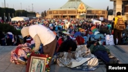 Pilgrims gather to celebrate at the Basilica of Our Lady of Guadalupe during the annual Virgin of Guadalupe feast day, in Mexico City, Dec. 12, 2024. 