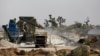 FILE - A truck is packed with crushed granite at a mining plant in Zamfara, Nigeria, April 21, 2016.