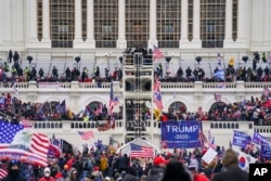 FILE - Supporters loyal to former President Donald Trump attacked the U.S. Capitol in Washington, Jan. 6, 2021. (AP Photo/John Minchillo, File)