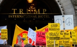 Antiwar activists demonstrate outside the Trump International Hotel in Washington, Jan. 4, 2020.