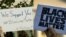 From left, a Baltimore police supporter holds a "Blue Lives Matter" poster, May 30, 2015; and a man holds a sign saying "Black Lives Matter" during a protest of shootings by police by the White House in Washington, July 8, 2016.