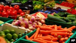 Fresh fruit and vegetables for sale at a market.