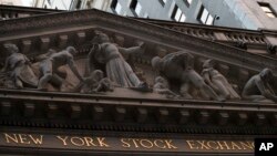 FILE - The New York Stock Exchange is seen at sunset, in lower Manhattan, Oct. 25, 2016.