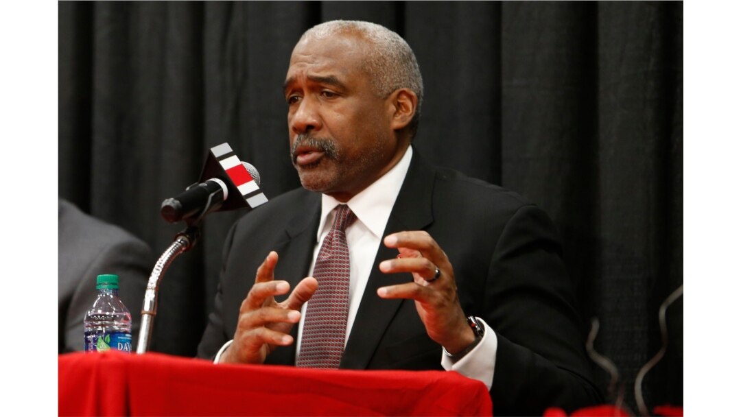 FILE - Ohio State athletics director Gene Smith answers questions during a news conference in Columbus, Ohio, Dec. 4, 2018.