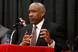 FILE - Ohio State athletics director Gene Smith answers questions during a news conference in Columbus, Ohio, Dec. 4, 2018.