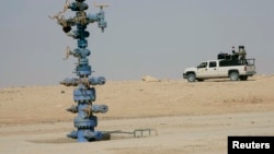 An Iraqi army vehicle secures the Akkas gas field in the western desert of Iraq, Oct. 19, 2010.