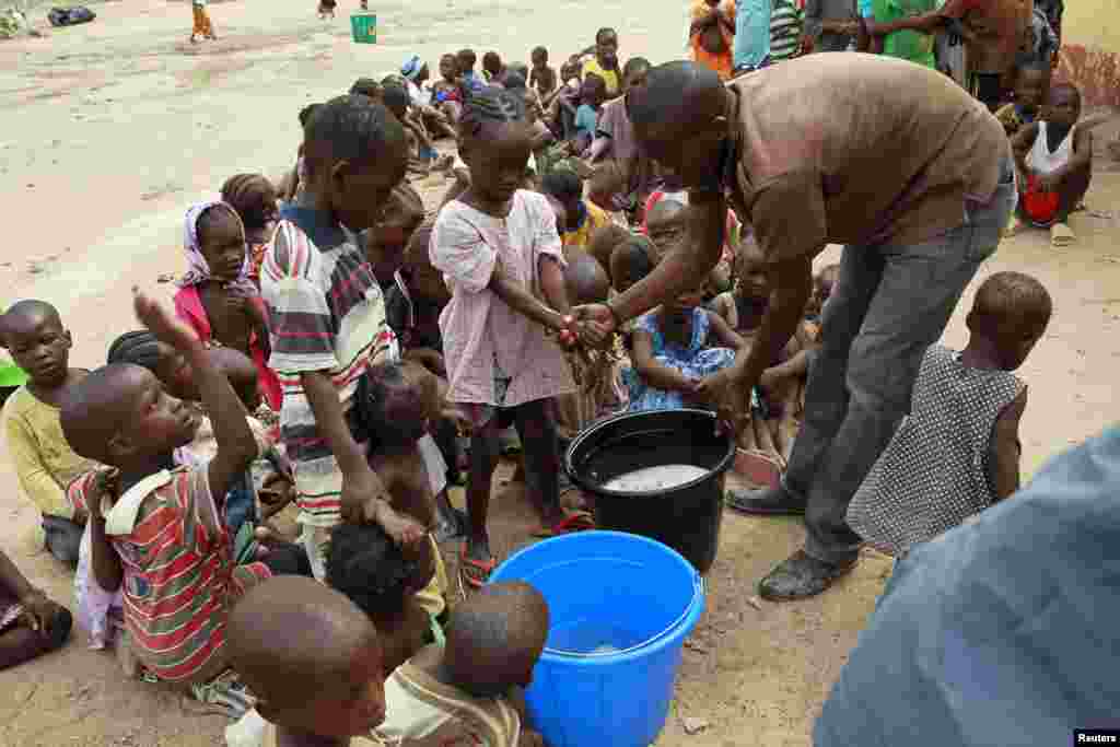 Children rescued from Boko Haram in Sambisa forest wash their hands at the Malkohi camp in Yola, May 3, 2015.