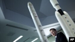 Elon Musk, CEO of Space Exploration Technologies Corp, speaks during a news conference in Washington, DC. to announce SpaceX's Falcon Heavy rocket should be ready for use by the end of 2012, April 5, 2011