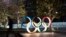 The Olympic rings are seen Monday, March 30, 2020, in Tokyo. The Tokyo Olympics will open next year in the same time slot scheduled for this year's games. 