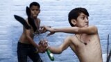 Shia Muslim boys flagellate themselves during a Muharram procession ahead of Ashura in Amroha, in the northern Indian state of Uttar Pradesh. Ashura, which falls on the 10th day of the Islamic month of Muharram, commemorates the death of Imam Hussein, grandson of Prophet Mohammad, who was killed in the 7th century battle of Kerbala.