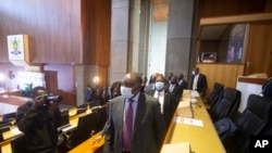 FILE - South African President Cyril Ramaphosa appears on behalf of the ruling ANC at the Zondo Commission of Inquiry into state corruption in Johannesburg, South Africa, April 29, 2021. He says rampant corruption has seriously damaged the economy and trust in government. 