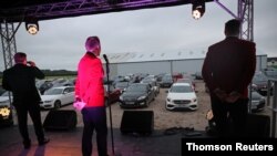 FILE - The Jersey Boys perform during a drive-in concert, following the coronavirus disease (COVID-19) outbreak, in Preston, Britain, June 26, 2020.