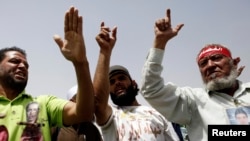 Relatives of protesters killed during Egypt's 2011 uprising shout slogans during the retrial of former president Hosni Mubarak in Cairo June 8, 2013.